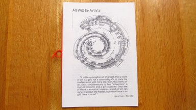 The front cover of (a physical copy of) the zine. It shows the spiral graphic score for George Crumb's Spiral Galaxy, below which is a quote from Lewis Hyde's The Gift, which begins: 'It is the assumption of this book that a work of art is a gift, not a commodity'.
