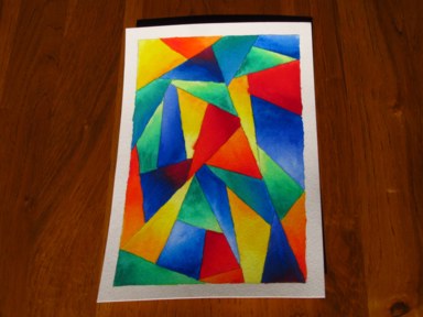 A painting of brightly-coloured facets, triangular and polygonal.