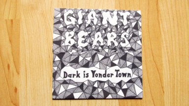 The CD envelope, with the words 'Giant Bears' and 'Dark is Yonder Town' written on it.